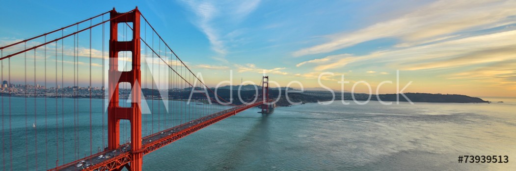 Picture of Golden Gate Bridge panorama San Francisco California sunset light on cloudy sky 